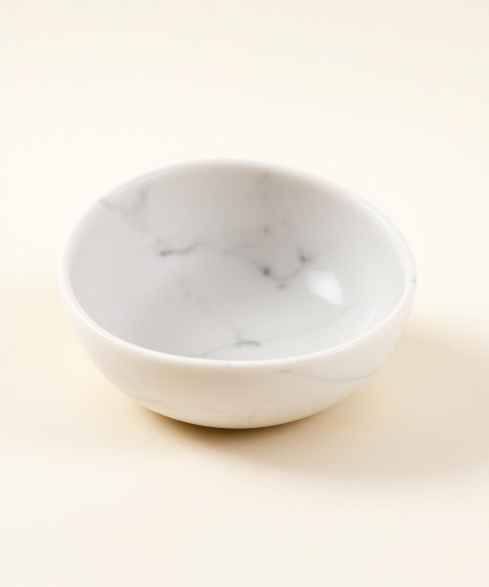 Shallow white marble decorative bowl from the Heimora collection
